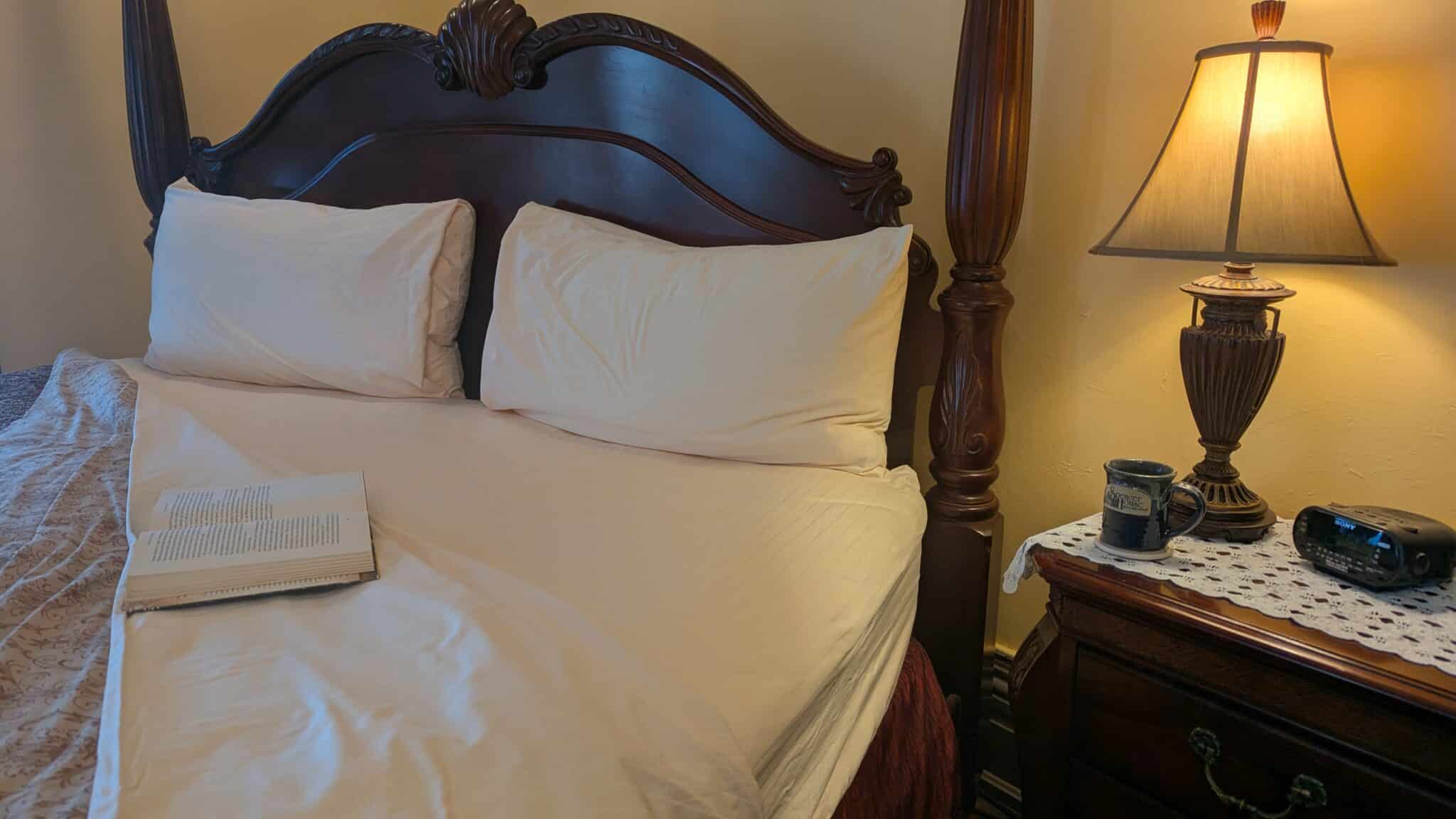 Turned-down bed with book at Spencer House Bed and Breakfast in Erie, Pennsylvania